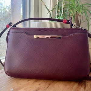 TUMI mini crossbody bag; deep purple leather with fuchsia accent